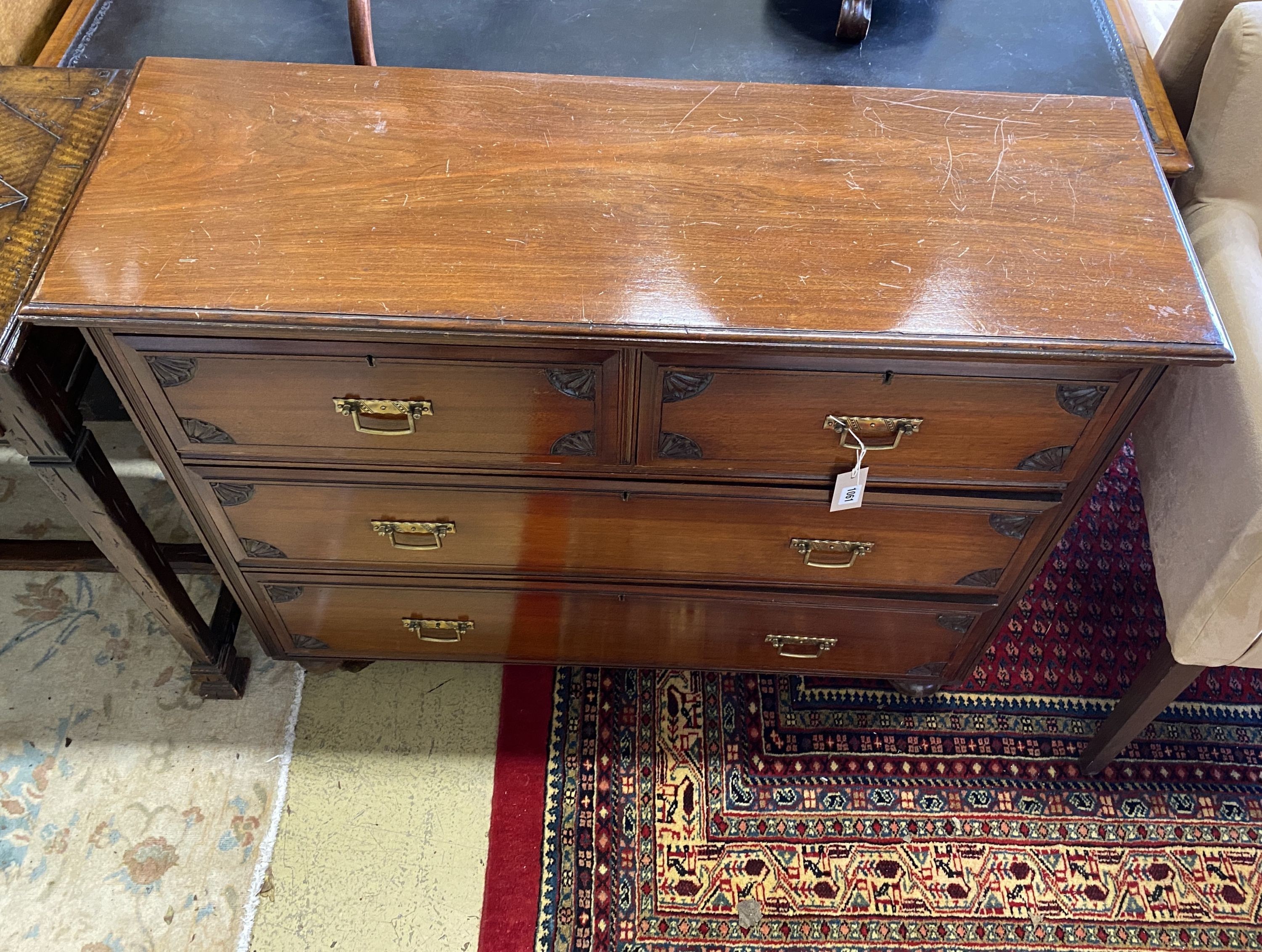 An Edwardian walnut chest of drawers, stamped Maple & Co., width 107cm, depth 36cm, height 86cm